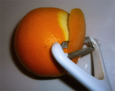 Peeling zest from the orange