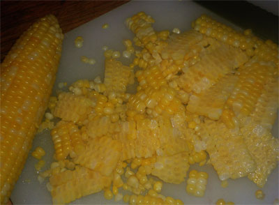 Cutting corn kernals from cob