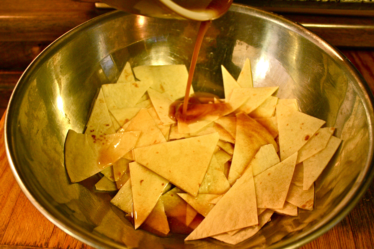 pouring butter on chips